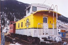 Painted in a fake Denver & Rio Grande paint and number. ATSF 999250 is located at 10th and Cement Streets in Silverton CO. Nov 2004.