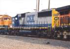 CSX 8590 on a NB BNSF BARPAS train turns north onto UP tracks at Stockton 12/04