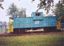 Great Northern Caboose x107 wears the paint of successor Railroad Burlington Northern 10147. Caboose is now on display in Liberal Missouri. Photo taken in October 2004.  S. Roger Kirkpatrick photos.