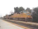 UP 4046 leads a westbound manifest at Davis CA 1/24/04