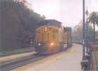 UP 6248 leads an eastbound stack train at Davis CA 1/24/04